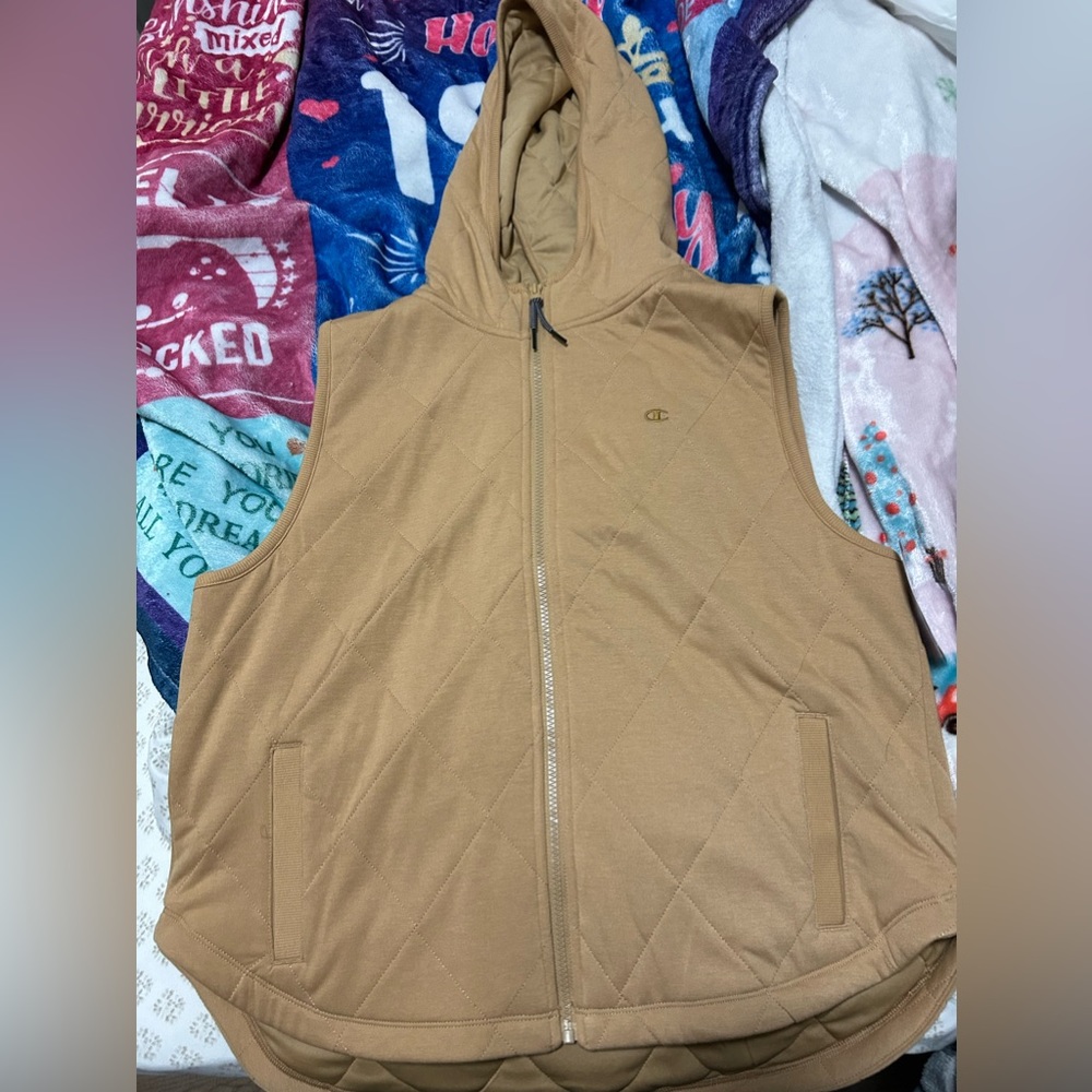 It’s a tan champion vest with hoodie, text me if interested , thank you
